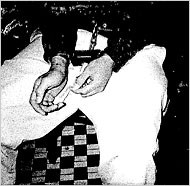 juvenile prisoner in handcuffs, waist chains and leg shackles
