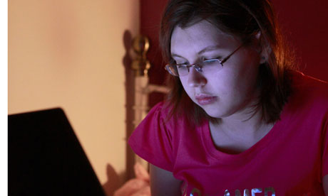 Teenager on laptop. Image shot 04/2009. Exact date unknown.